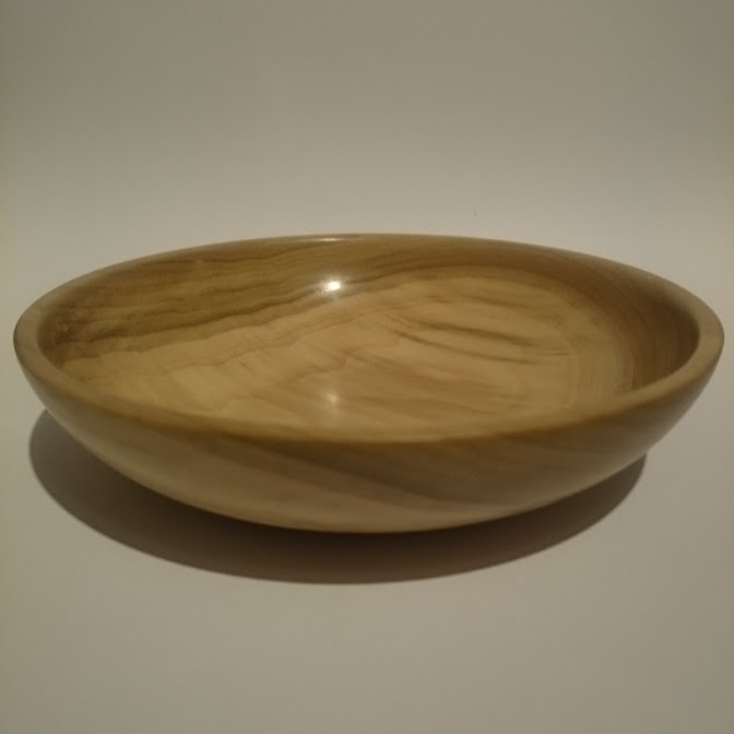A small tulipwood woodturned bowl